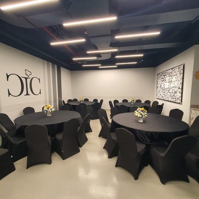 Function room laid with round tables and dressed chairs