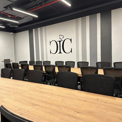 Long boardroom table seating around twenty