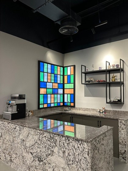 Coffee and beverage counter with a coloured tile feature wall