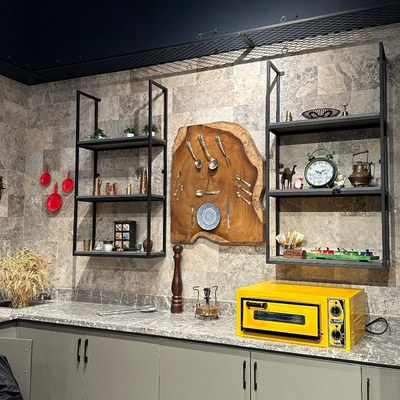 Detail of the styled shelving, carved wood board and countertop deck oven